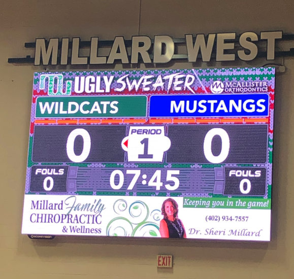 Ugly Sweater Night Themed Brand Wrapper on ScoreVision Video Scoreboard at Millard West High School